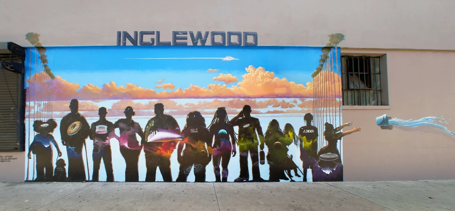 Communal Time by Patrick Henry Johnson, mural at Market Street and Manchester Boulevard